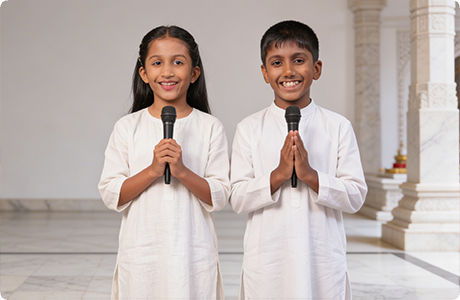 Jainam and Jivika reading a religious book