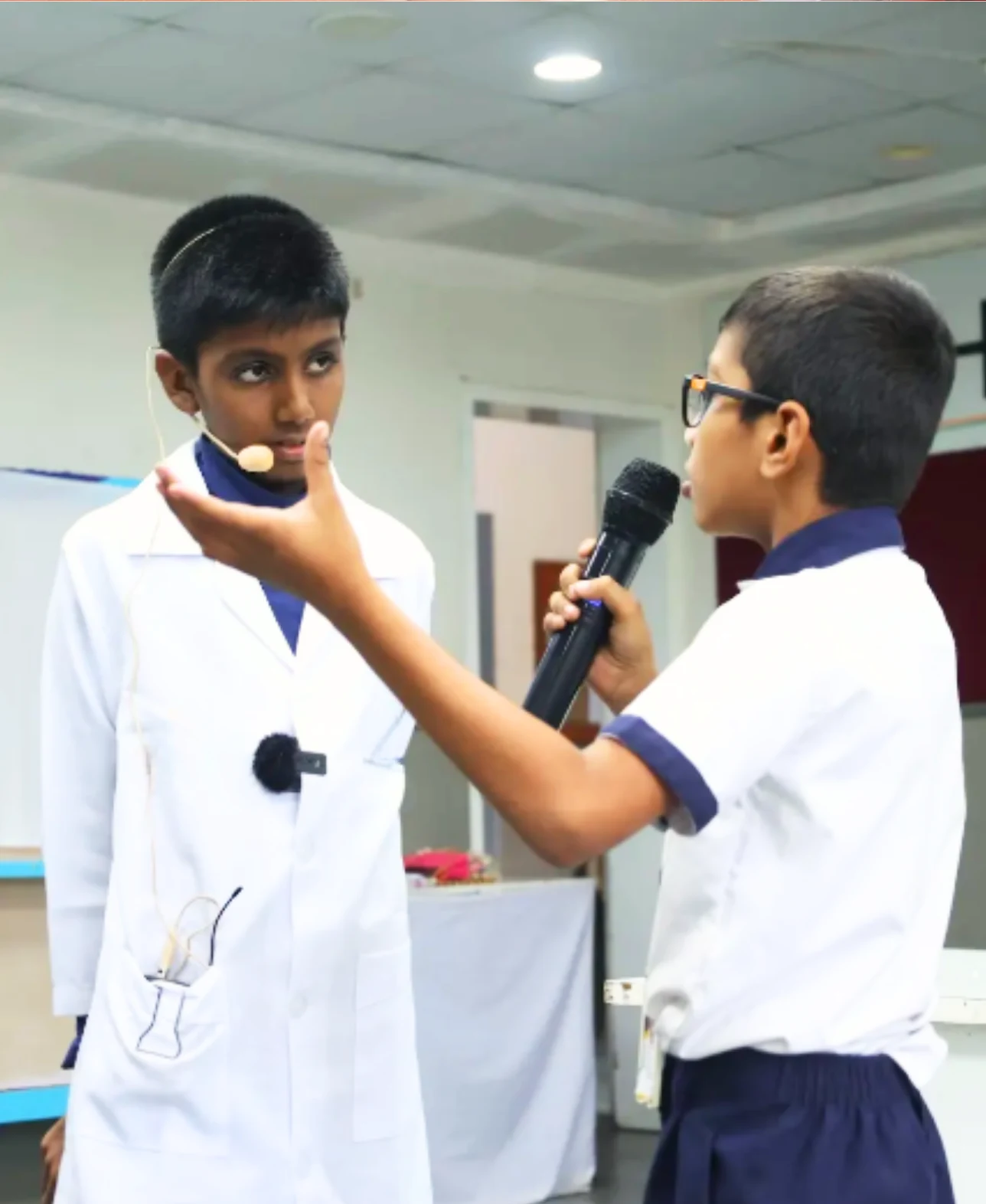 Student speaking on stage during workshop